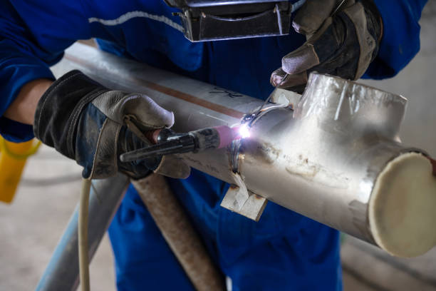 Chemical factory construction site worker welding